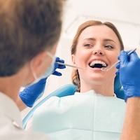 woman smiling getting dental work done